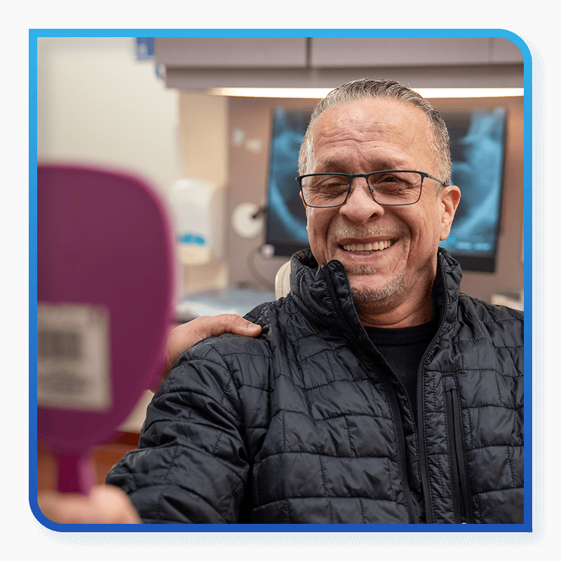patient looking at their new smile