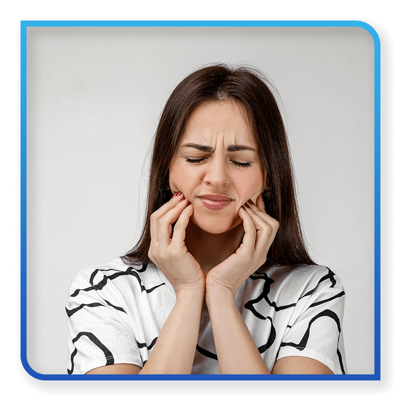 woman holding mouth in pain