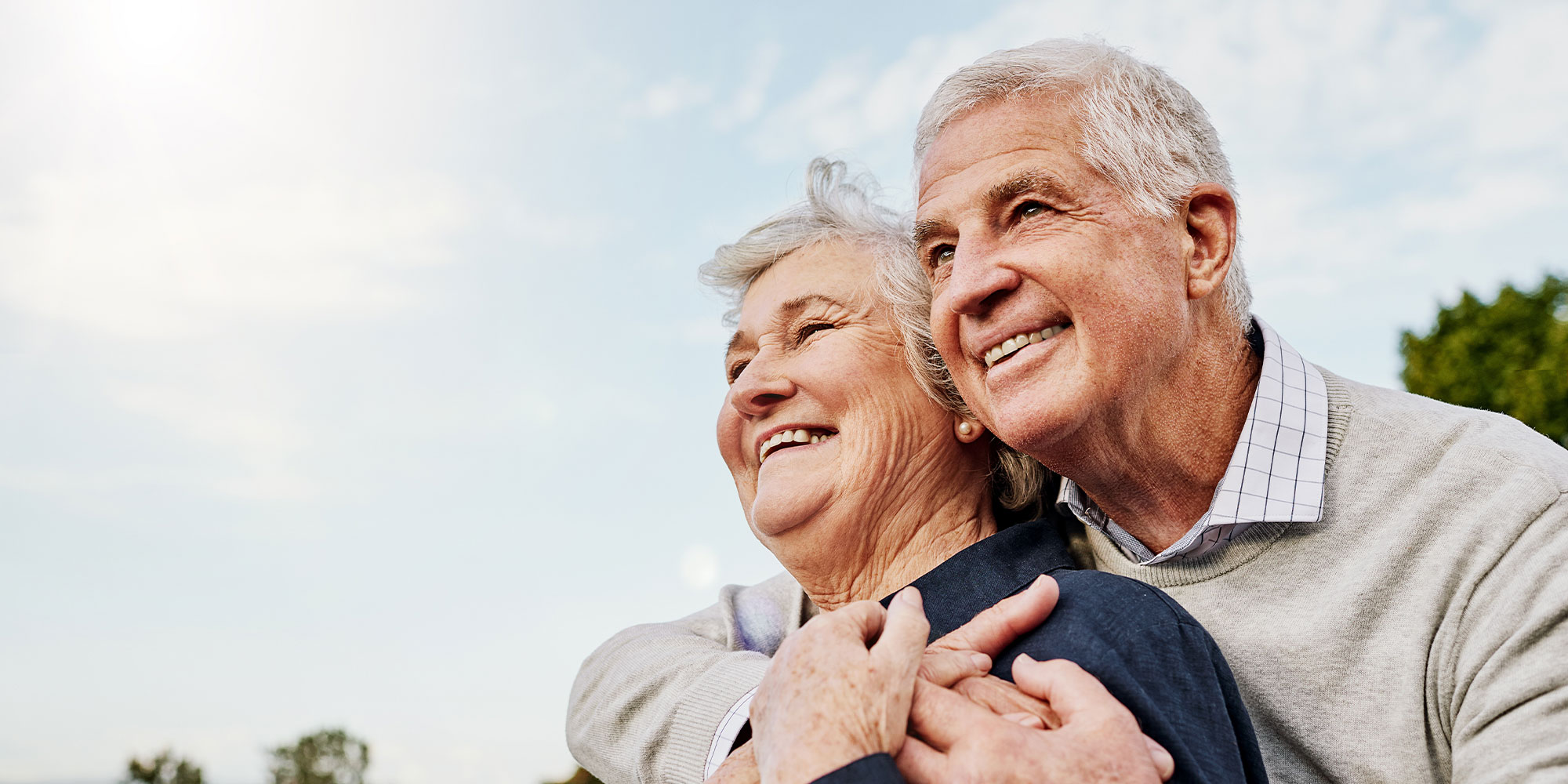 couple smiling again after new dentures