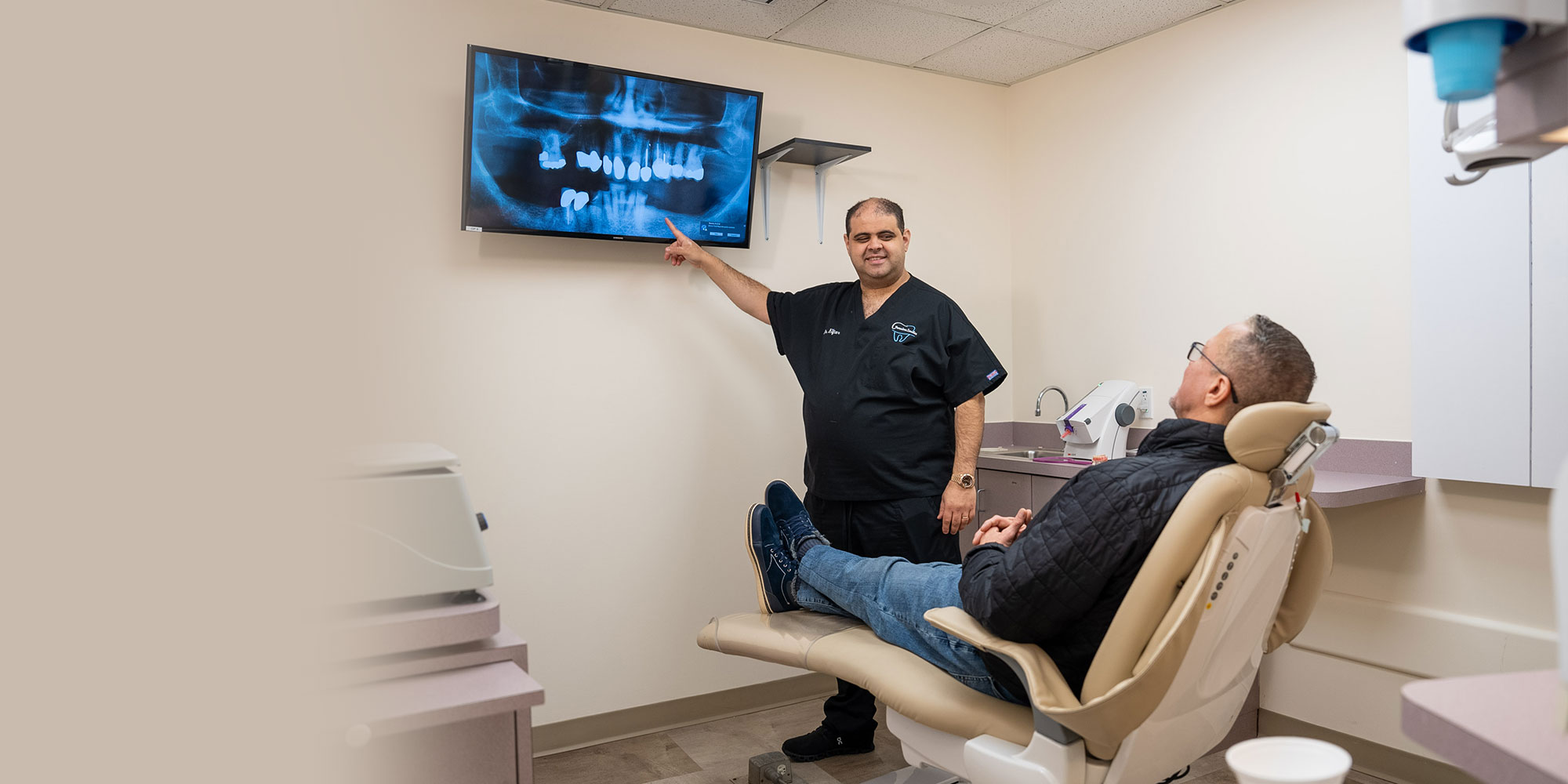 Mina Elfar, DMD consulting with patient about root canal treatment