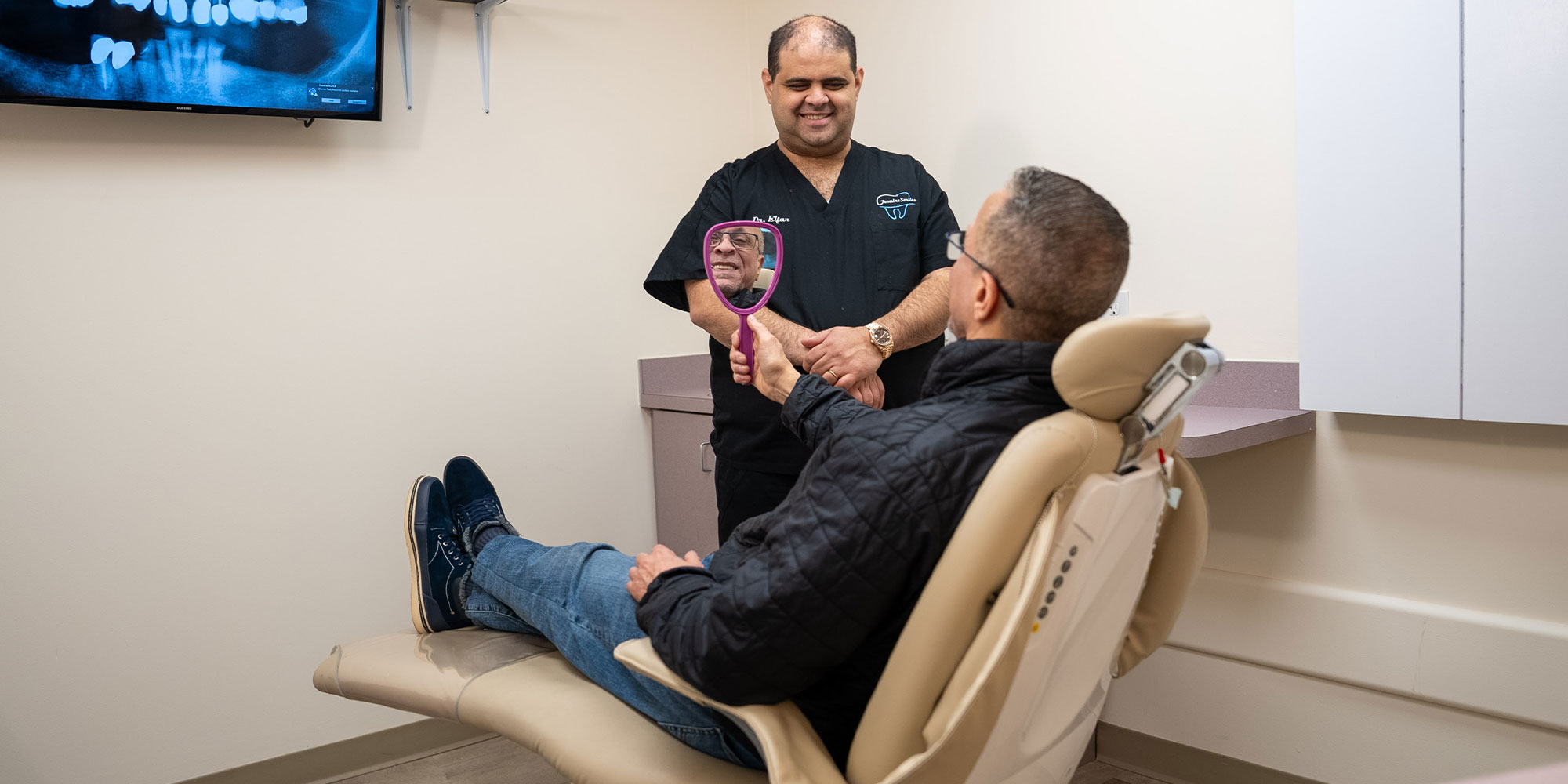 patient looking into mirror smiling