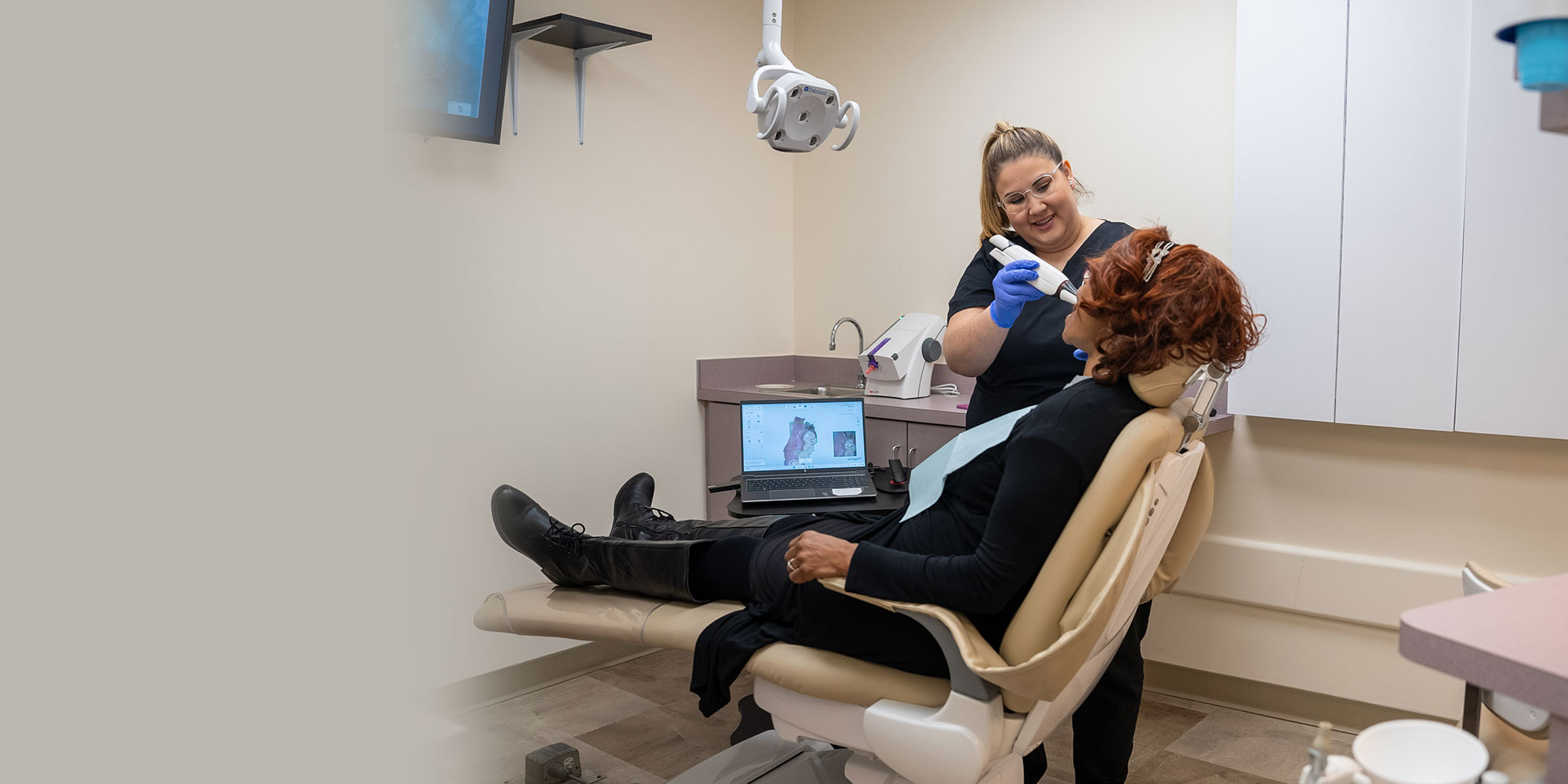 team member getting a 3d scan of patients mouth
